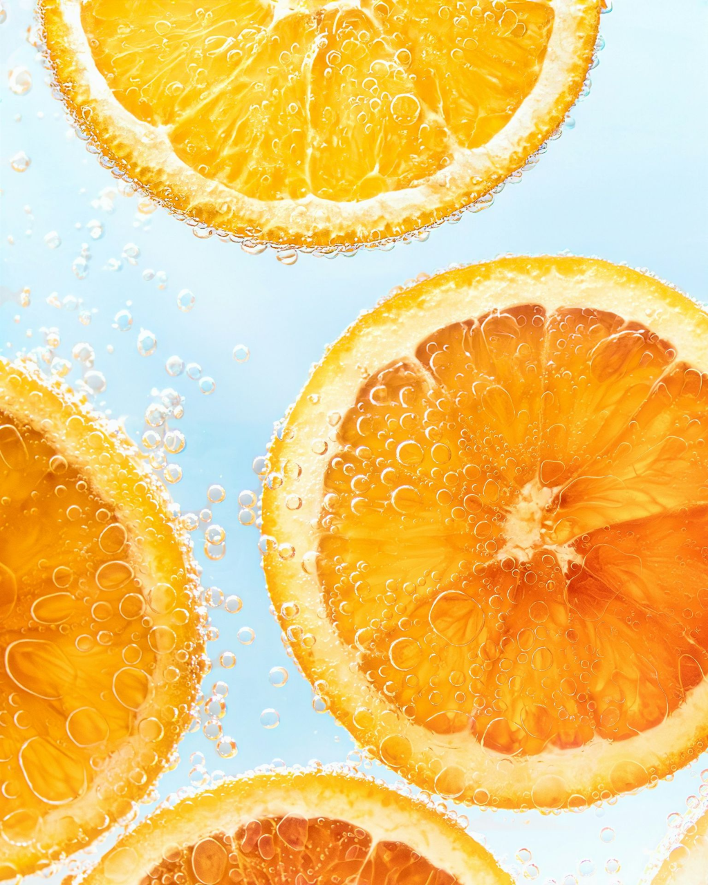 a group of sliced oranges sitting on top of a table
